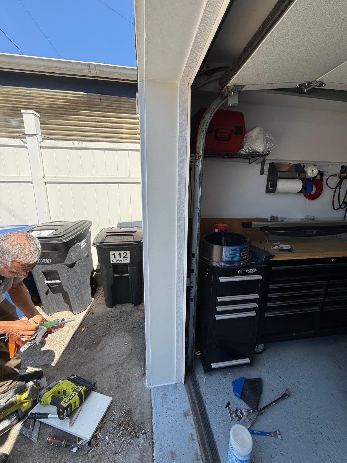 Angled view of the white trim around the garage opening.