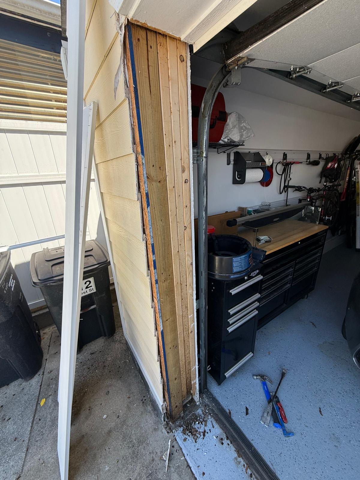 Garage jamb with the old trim removed, exposing the timber beneath.