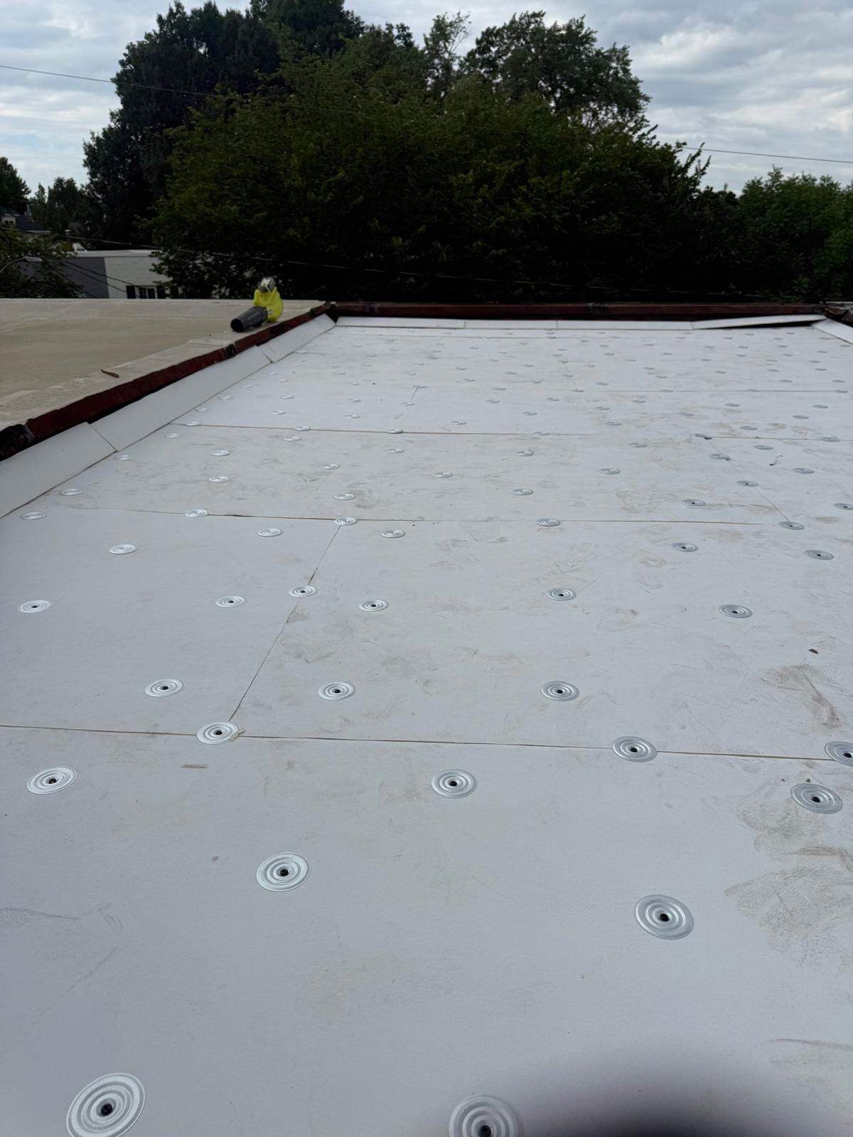 Roof membrane installation in progress.